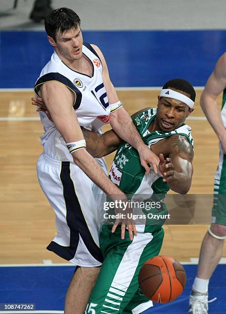 Darjus Lavrinovic, #12 of Fenerbahce Ulker Istanbul competes with Travis Watson, #35 of Zalgiris during the 2010-2011 Turkish Airlines Euroleague Top...