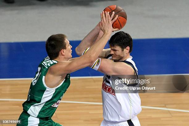 Darjus Lavrinovic, #12 of Fenerbahce Ulker Istanbul competes with Paulius Jankunas, #13 of Zalgiris during the 2010-2011 Turkish Airlines Euroleague...
