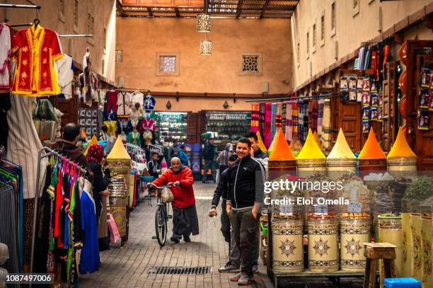 narrow streets and spices store in the souk of marrakech, morocco - marrakech spice stock pictures, royalty-free photos & images