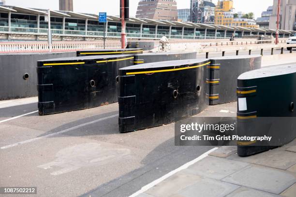 anti-terror security barriers on a street. - terrorism stock pictures, royalty-free photos & images