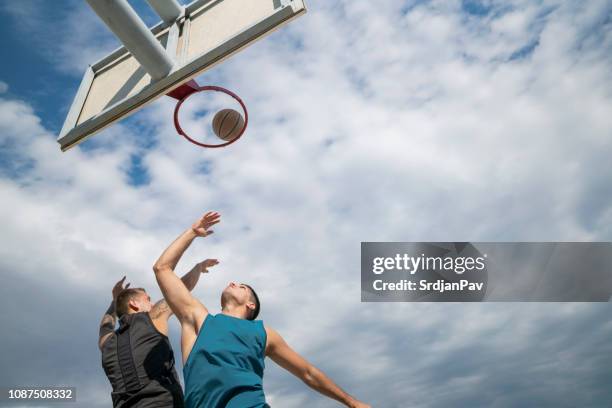 1-on-1 on the hoop - basketball court stock pictures, royalty-free photos & images