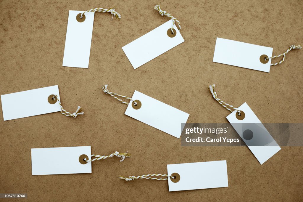 Xmas tags and decoration for gifts in rustic background