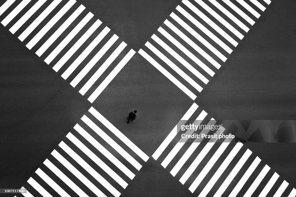 Aerial view of people crossing a big intersection in Ginza, Tokyo, Japan
