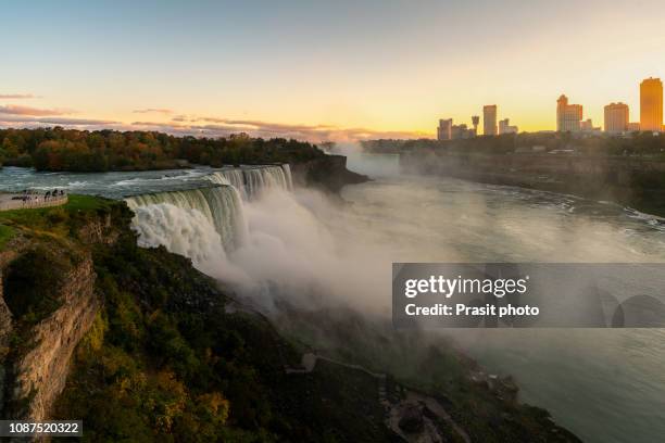 niagara falls waterfall and colorful sky at dawn in new york, usa. - niagara-falls-new-york stock pictures, royalty-free photos & images