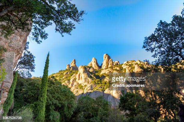 panoramic view of montserrat geology formations in the mountains, barcelona, spain - monserrat mountain stock pictures, royalty-free photos & images