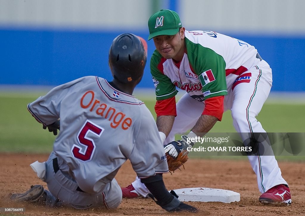 Mexican shortstop Oscar Robles (R) puts