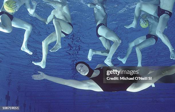 Swimsuit Issue 1994: US Olympic swimmer Dara Torres underwater with US Water Polo team pose for the 1994 Sports Illustrated swimsuit issue on...