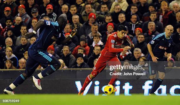 Luis Suarez of Liverpool bursts through towards goal during the Barclays Premier League match between Liverpool and Stoke City at Anfield on February...