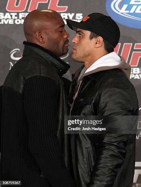 Middleweight Champion Anderson Silva faces off with opponent Vitor Belfort at the UFC 126 pre-fight press conference at the Mandalay Bay Resort and...