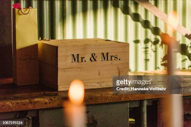 wooden giftbox with mr & mrs on a wedding reception - wedding gift stock pictures, royalty-free photos & images