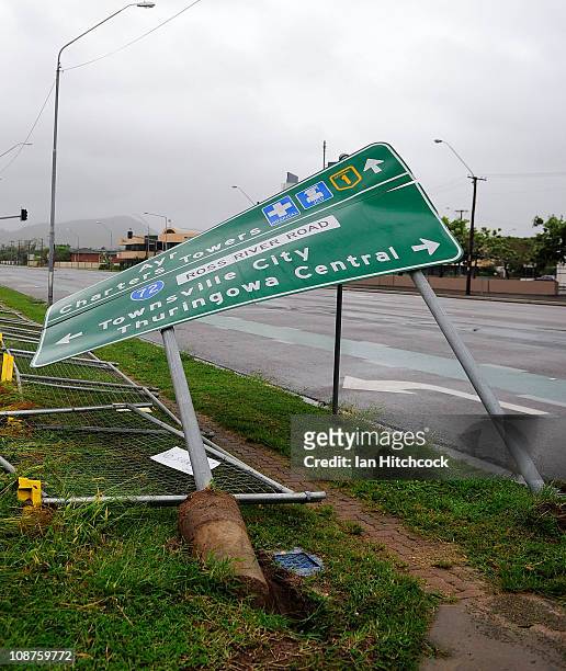 Damaged roadside sign is seen laying on its side after the passing of Cyclone Yasi on February 3, 2011 in Townsville, Australia. So far no deaths or...