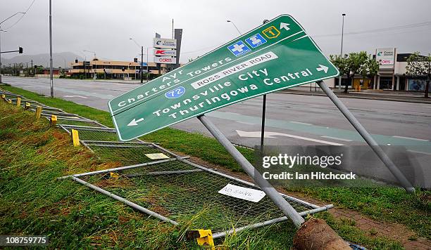 Damaged roadside sign is seen laying on its side after the passing of Cyclone Yasi on February 3, 2011 in Townsville, Australia. So far no deaths or...