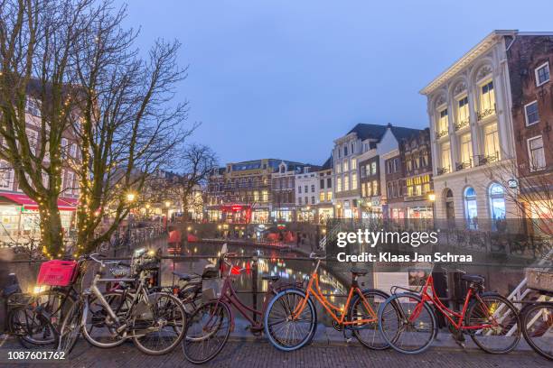 geparkeerde fietsen in de binnenstad van utrecht - moat stock pictures, royalty-free photos & images