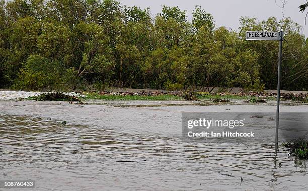 Minor flooding caused from a storm surge is seen covering a road after the passing of Cyclone Yasi on February 3, 2011 in Townsville, Australia. So...