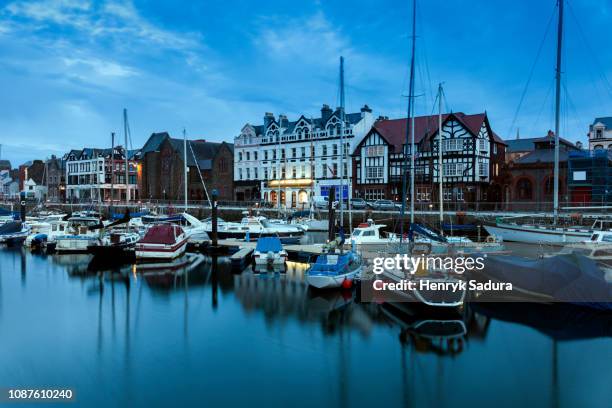 boats moored on waterfront of douglas, isle of man - isle of man stock pictures, royalty-free photos & images