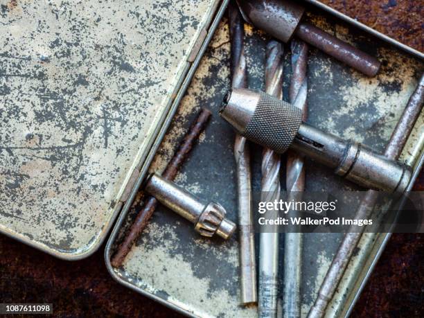 drill bits in metal box - drill bit stock pictures, royalty-free photos & images
