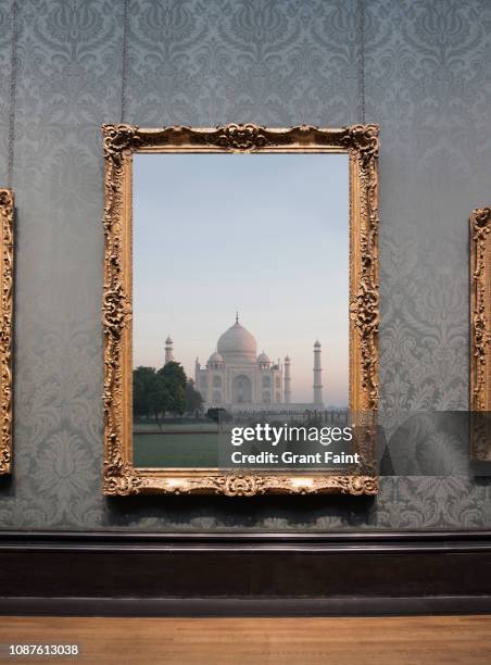 framed photograph hanging on wall. - gold meets golden fotografías e imágenes de stock