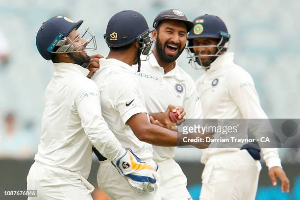 Indian players celebrate the wicket of Marcus Harris of Australia during day four of the Third Test match in the series between Australia and India...