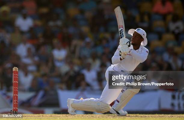 Shimron Hetmyer of the West Indies hits out during the first Test match between England and the West Indies at Kensington Oval on January 23, 2019 in...