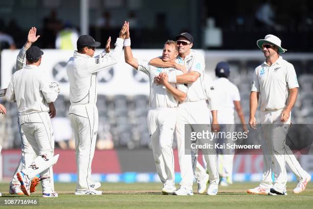 Neil Wagner of New Zealand is congratulated by team mates after dismissing Roshene Silva of Sri Lanka during day four of the Second Test match in the...