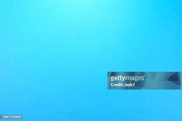 blue colored paper background - blu chiaro foto e immagini stock