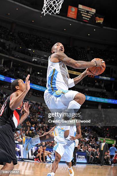 Smtih of the Denver Nuggets goes to the basket against Andre Miller of the Portland Trail Blazers on February 2, 2011 at the Pepsi Center in Denver,...