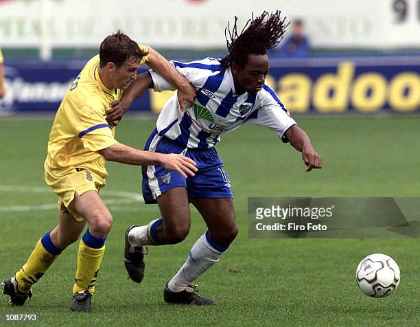 Kiki Musampa of Malaga and Moreno Berdu Josico of Las Palmas in action during the Primera Liga match between Malaga and Las Palmas, played at La...