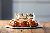 King Cake or King Bread, called in German language Dreikönigskuchen, baked in Switzerland on January 6th. Small plastic miniature of the king is hidden inside of the bread. The person who finds it, is called the king of the day.