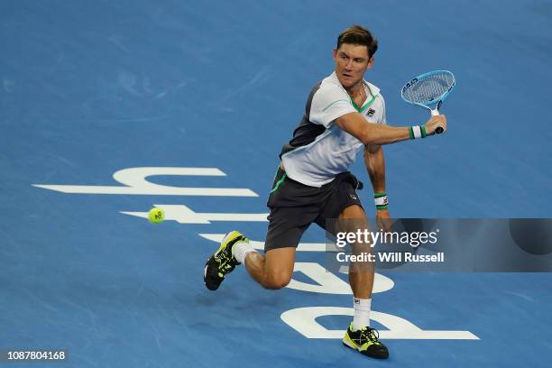 Matt Ebden of Australia plays a backhand to Lucas Pouille of France in the mens singles match during day one of the 2019 Hopman Cup at RAC Arena on...