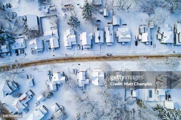 aerial of main street village in winter - village america stock-fotos und bilder