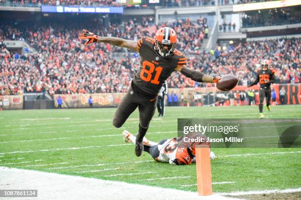 Wide receiver Rashard Higgins of the Cleveland Browns evades a take from cornerback Darius Phillips of the Cincinnati Bengals to score a touchdown...