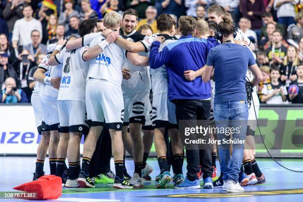 The team of Germany celebrates its win during the Main Group 1 match on the 26th IHF Men's World Championship between Germany and Spain at the...