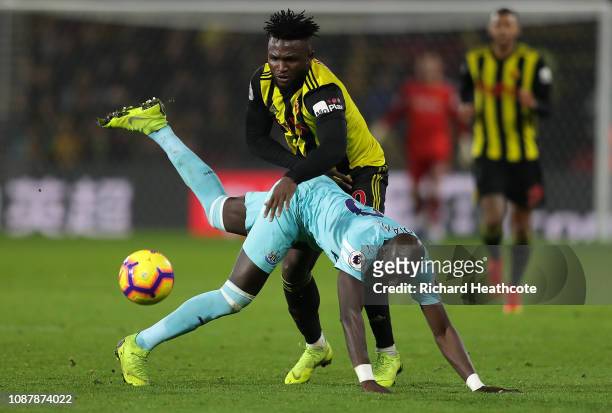 Isaac Success of Watford shakes off a tackle by Mohamed Diame of Newcastle United during the Premier League match between Watford FC and Newcastle...