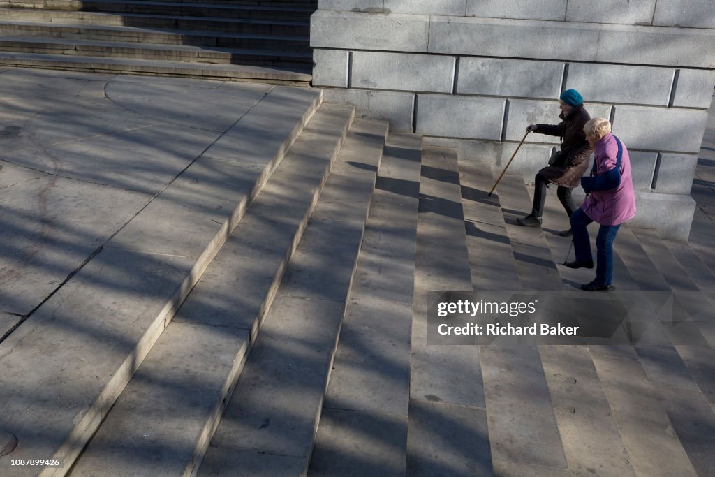 Ladies Struggling Up Steps