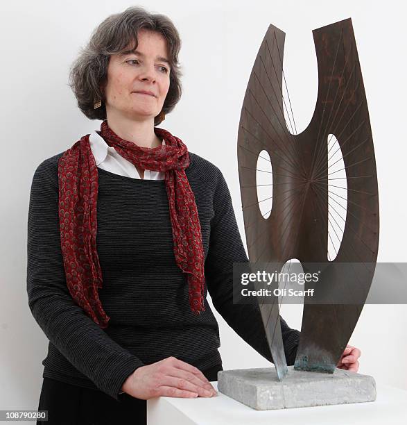 Sophie Bowness, the granddaughter of sculptor Barbara Hepworth, poses with a maquette of Hepworth's sculpture Winged Figure 1957 on February 2, 2011...
