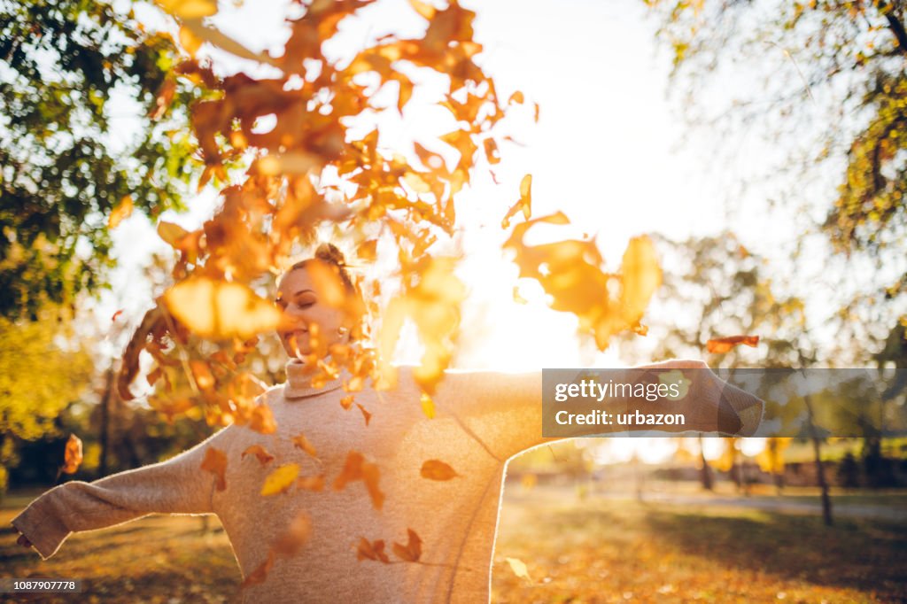 Throwing leaves in the air