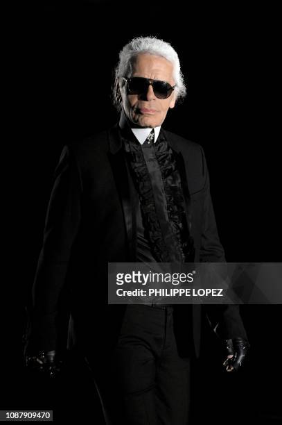 Fashion designer Karl Lagerfeld appears at the end of the Chanel Paris Shanghai fashion show in Shanghai on December 3, 2009. Sharp-tongued German...