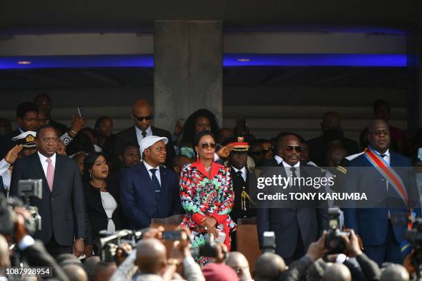 Democratic Republic of the Congo's newly inaugurated President Felix Tshisekedi , stands next to DRCongo's outgoing President Joseph Kabila and his...