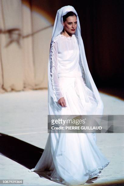 French model Ines de la Fressange presents a creation by fashion designer Karl Lagerfeld for Chanel, on July 26, 1988 at the Champs Elysees theater...