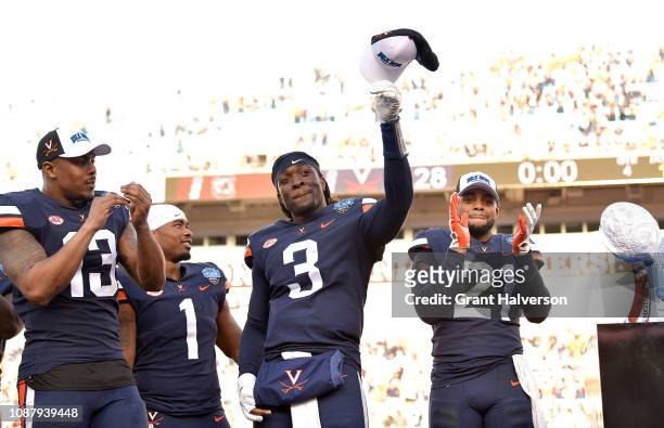 Bryce Perkins of the Virginia Cavaliers salutes the fans after a win against the South Carolina Gamecocks during the Belk Bowl at Bank of America...