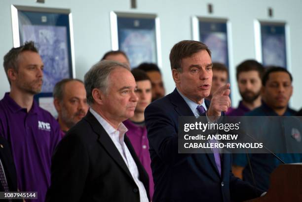 Senator Mark Warner, Democrat of Virginia, speaks next to US Senator Tim Kaine , Democrat of Virginia during a press conference on aviation safety...