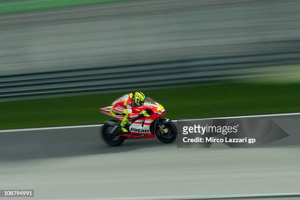 Valentino Rossi of Italy and and Ducati Marlboro Team heads down a straight during the third day of testing at Sepang Circuit on February 3, 2011 in...