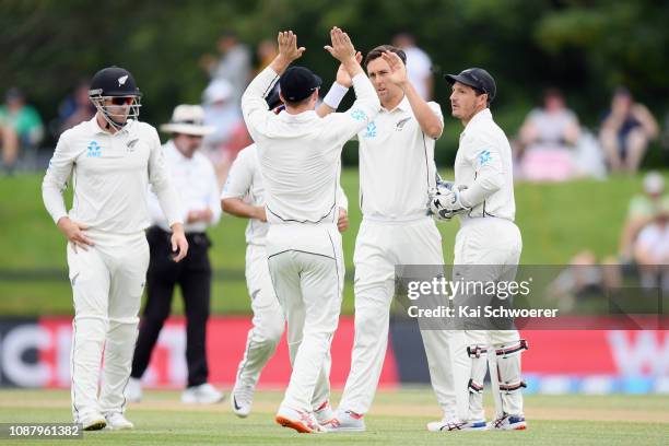 Trent Boult of New Zealand is congratulated by team mates after dismissing Suranga Lakmal of Sri Lanka during day five of the Second Test match in...