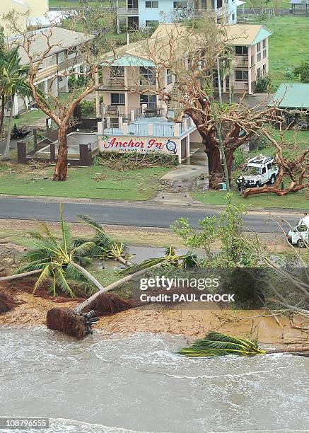 This aerial view shows a buildings and vegetation damaged after Cyclone Yasi hit the Queensland coastal area of Mission Beach on February 3, 2011....