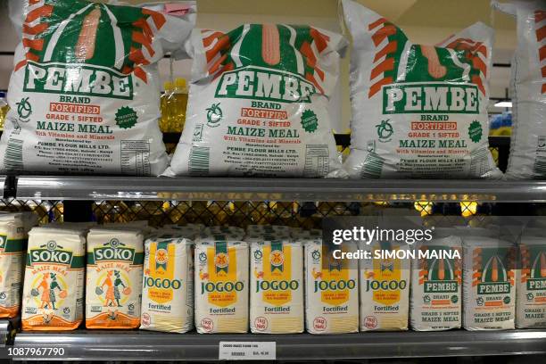 Maize flour bags are displayed on shelves at the Quick Mart Lavington supermarket in Nairobi on January 24, 2019.