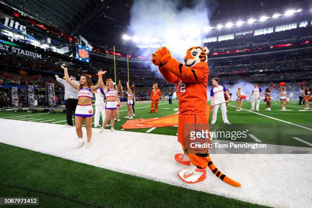 The Clemson Tigers mascot and cheerleaders wave to the crowd during the College Football Playoff Semifinal Goodyear Cotton Bowl Classic against the...