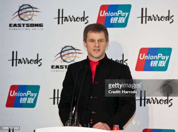 Peter Recknager, EastSong Consulting UK Director speaks during a press conference to announce Harrods accepting UnionPay debit cards on February 3,...