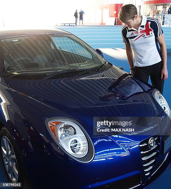 Kelly Sotherton British heptathlon and 400m athlete looks at her reflection in the new Alfa Romeo MiTo Sprint Special Edition during its launch in...