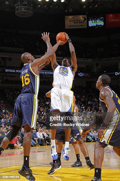 Ekpe Udoh of the Golden State Warriors shoots a fade away against Francisco Elson of the Utah Jazz on January 30, 2011 at Oracle Arena in Oakland,...
