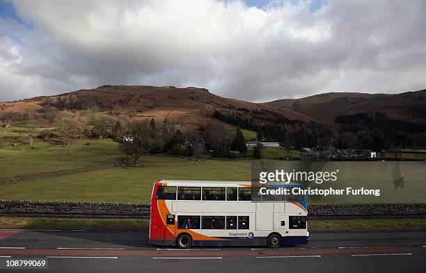 Rural bus service makes it's way through the Lake District on February 3, 2011 in Grasmere, England. More than two thirds of English councils are...